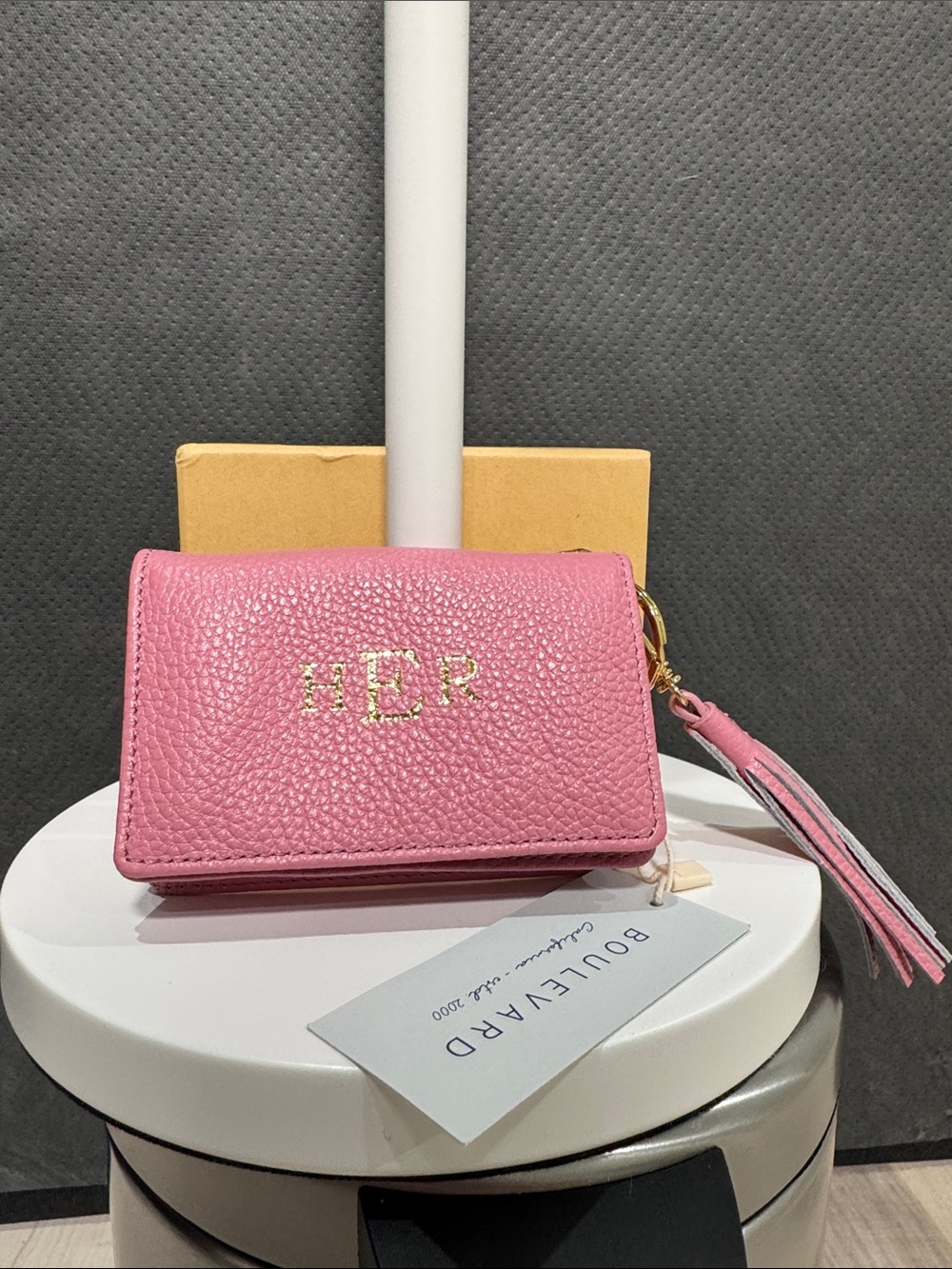 Compact Pink Pebbled Leather Wallet with Tassel